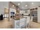 Gourmet kitchen with a granite island, stainless steel appliances, and white cabinetry for ample storage at 4542 Amber Canyon Ln, Las Vegas, NV 89129