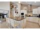 Open concept kitchen with granite countertops, stainless appliances and breakfast bar seating at the island at 4542 Amber Canyon Ln, Las Vegas, NV 89129