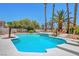 Bright pool with a spa, several palm trees, and plenty of room for outdoor relaxation at 4542 Amber Canyon Ln, Las Vegas, NV 89129