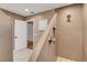 Walk in shower with unique architectural design, neutral tones, rainfall shower head, and white door at 4542 Amber Canyon Ln, Las Vegas, NV 89129