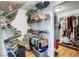 Spacious walk-in closet with shelving and rods for ample storage at 4542 Amber Canyon Ln, Las Vegas, NV 89129