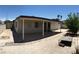 A home's backyard is paved with gravel and features a covered patio at 462 Crestway Rd, Henderson, NV 89015