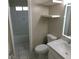 Cozy bathroom with tiled shower/tub combo and updated vanity with drawers and shelving at 462 Crestway Rd, Henderson, NV 89015
