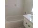 Close up of a bathroom with updated vanity, tiled walls, and shower/tub combo at 462 Crestway Rd, Henderson, NV 89015