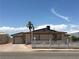 Charming single-story home featuring a white picket fence and desert landscaping at 462 Crestway Rd, Henderson, NV 89015