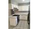 Clean kitchen featuring white cabinets, island cooktop, and stainless steel appliances at 462 Crestway Rd, Henderson, NV 89015