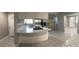 Bright kitchen features an island with cooktop and stainless steel appliances at 462 Crestway Rd, Henderson, NV 89015
