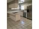 Well-lit kitchen featuring white cabinets, stainless appliances and a functional layout at 462 Crestway Rd, Henderson, NV 89015