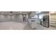 Open-concept living area adjacent to a bright kitchen with white cabinets and stainless appliances at 462 Crestway Rd, Henderson, NV 89015