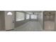Spacious living room featuring tile floors, multiple windows, and a ceiling fan at 462 Crestway Rd, Henderson, NV 89015