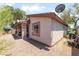 Exterior image of the backyard with gravel landscaping and a covered patio space at 4656 E Desert Inn Rd, Las Vegas, NV 89121