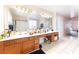 Bathroom features a double sink vanity and a large mirror at 4656 E Desert Inn Rd, Las Vegas, NV 89121