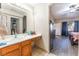 Bathroom with a single sink vanity and an entrance to the main bedroom at 4656 E Desert Inn Rd, Las Vegas, NV 89121