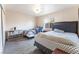 Bright bedroom featuring two beds, wood look flooring, natural light, and closet space for comfortable living at 4656 E Desert Inn Rd, Las Vegas, NV 89121