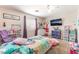 bedroom featuring a colorful decor, carpet, and a window providing natural light at 4656 E Desert Inn Rd, Las Vegas, NV 89121