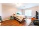 Comfortable bedroom with wood-look floors, a comfortable bed and natural light at 4656 E Desert Inn Rd, Las Vegas, NV 89121
