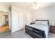 Bedroom with wood-look flooring, and a ceiling fan with an open doorway to the rest of the house at 4656 E Desert Inn Rd, Las Vegas, NV 89121