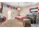 Bedroom with carpet, ceiling fan, and decorations hanging on the wall at 4656 E Desert Inn Rd, Las Vegas, NV 89121
