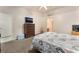Cozy bedroom with a ceiling fan, complemented by soft carpeting and ample natural light at 4656 E Desert Inn Rd, Las Vegas, NV 89121