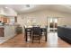Open dining area features wood floors and sliding glass door to yard, providing natural light at 4656 E Desert Inn Rd, Las Vegas, NV 89121
