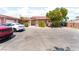 Front exterior view of a single story home featuring a spacious driveway at 4656 E Desert Inn Rd, Las Vegas, NV 89121