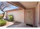 Inviting front entry with a security screen door and desert-friendly landscaping at 4656 E Desert Inn Rd, Las Vegas, NV 89121
