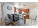 Cozy kitchen featuring a breakfast bar and tile floors at 4656 E Desert Inn Rd, Las Vegas, NV 89121