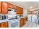 Well-equipped kitchen with modern appliances, including a range, oven, and washer and dryer hookups at 4656 E Desert Inn Rd, Las Vegas, NV 89121