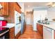 Cozy kitchen with stainless steel appliances and wood cabinets at 4656 E Desert Inn Rd, Las Vegas, NV 89121