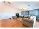 Well-lit living room offering a cozy sectional and hardwood flooring at 4656 E Desert Inn Rd, Las Vegas, NV 89121