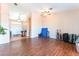 Spacious living room with hardwood floors and a ceiling fan at 4656 E Desert Inn Rd, Las Vegas, NV 89121