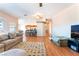 Spacious living room with hardwood floors flowing into an open floor plan at 4656 E Desert Inn Rd, Las Vegas, NV 89121