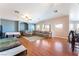 Bright living room boasts hardwood floors and a comfortable sectional sofa at 4656 E Desert Inn Rd, Las Vegas, NV 89121