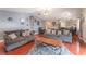 Spacious living room with hardwood floors, neutral paint and open concept view of kitchen at 4656 E Desert Inn Rd, Las Vegas, NV 89121