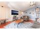 Inviting living room with hardwood floors, a large TV, and comfortable seating area at 4656 E Desert Inn Rd, Las Vegas, NV 89121