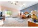 Large main bedroom features carpet floors, ceiling fans, and sliding glass doors at 4656 E Desert Inn Rd, Las Vegas, NV 89121