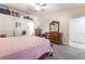 Spacious main bedroom featuring wood-look flooring, and a separate bathroom at 4656 E Desert Inn Rd, Las Vegas, NV 89121