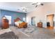 Large main bedroom features carpet floors, ceiling fans, and attached bath at 4656 E Desert Inn Rd, Las Vegas, NV 89121