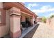 Covered patio features gravel landscaping and a cozy seating area for outdoor enjoyment at 4656 E Desert Inn Rd, Las Vegas, NV 89121