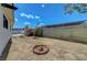 Large backyard space ready for customization, framed by mature bushes and block wall at 4807 Sacks Dr, Las Vegas, NV 89122