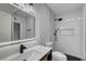 Bathroom featuring modern lighting, dark fixtures, and black honeycomb flooring in the shower at 4807 Sacks Dr, Las Vegas, NV 89122