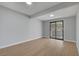 Bedroom featuring light wood floors, light gray walls, and a sliding glass door at 4807 Sacks Dr, Las Vegas, NV 89122