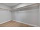 Walk-in closet with gray walls, light wood floors, and two shelves for storage at 4807 Sacks Dr, Las Vegas, NV 89122