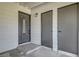 A welcoming front entrance featuring a decorative glass door, neutral siding, and well-maintained surroundings with extra door at 4807 Sacks Dr, Las Vegas, NV 89122