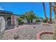 Inviting front yard with drought tolerant landscaping, brick accents, perimeter fencing and a gated entrance for added privacy at 4807 Sacks Dr, Las Vegas, NV 89122