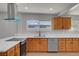 Well-lit kitchen with stainless steel appliances and light wood cabinets at 4807 Sacks Dr, Las Vegas, NV 89122