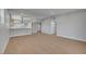 Spacious living room and open concept kitchen with sleek wood floors and recessed lighting at 4807 Sacks Dr, Las Vegas, NV 89122