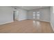 Bright living room features sleek wood floors, recessed lighting, and double glass doors at 4807 Sacks Dr, Las Vegas, NV 89122