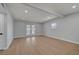 Bright living room features sleek wood floors, recessed lighting, and double glass doors at 4807 Sacks Dr, Las Vegas, NV 89122