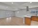Bright living room features sleek wood floors, recessed lighting, and double glass doors at 4807 Sacks Dr, Las Vegas, NV 89122